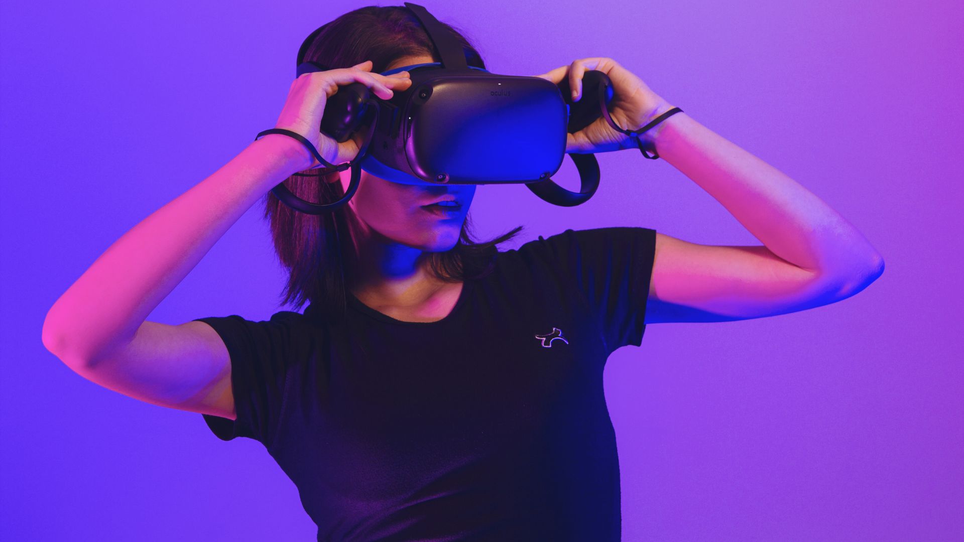 A woman adjusting her VR headset