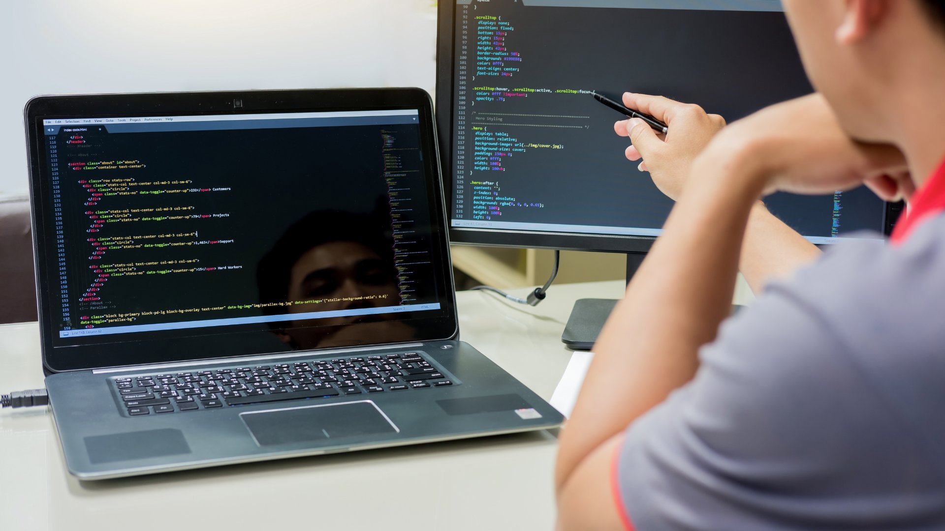 A person looking at code on a screen